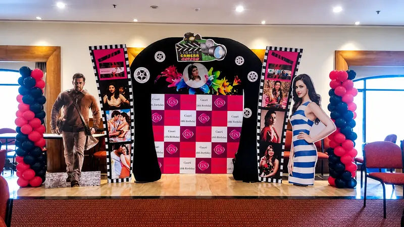 A Bollywood-styled Lights Camera backdrop built for an eighteenth birthday